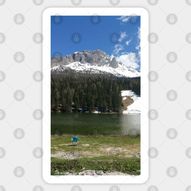 The fabulous alpine lake of Misurina in the Dolomites. Lovely and relaxing place in the Italian Alps. Chair on the shore. Reflections in the rippled water. Sunny spring day. Sticker by fabbroni-art